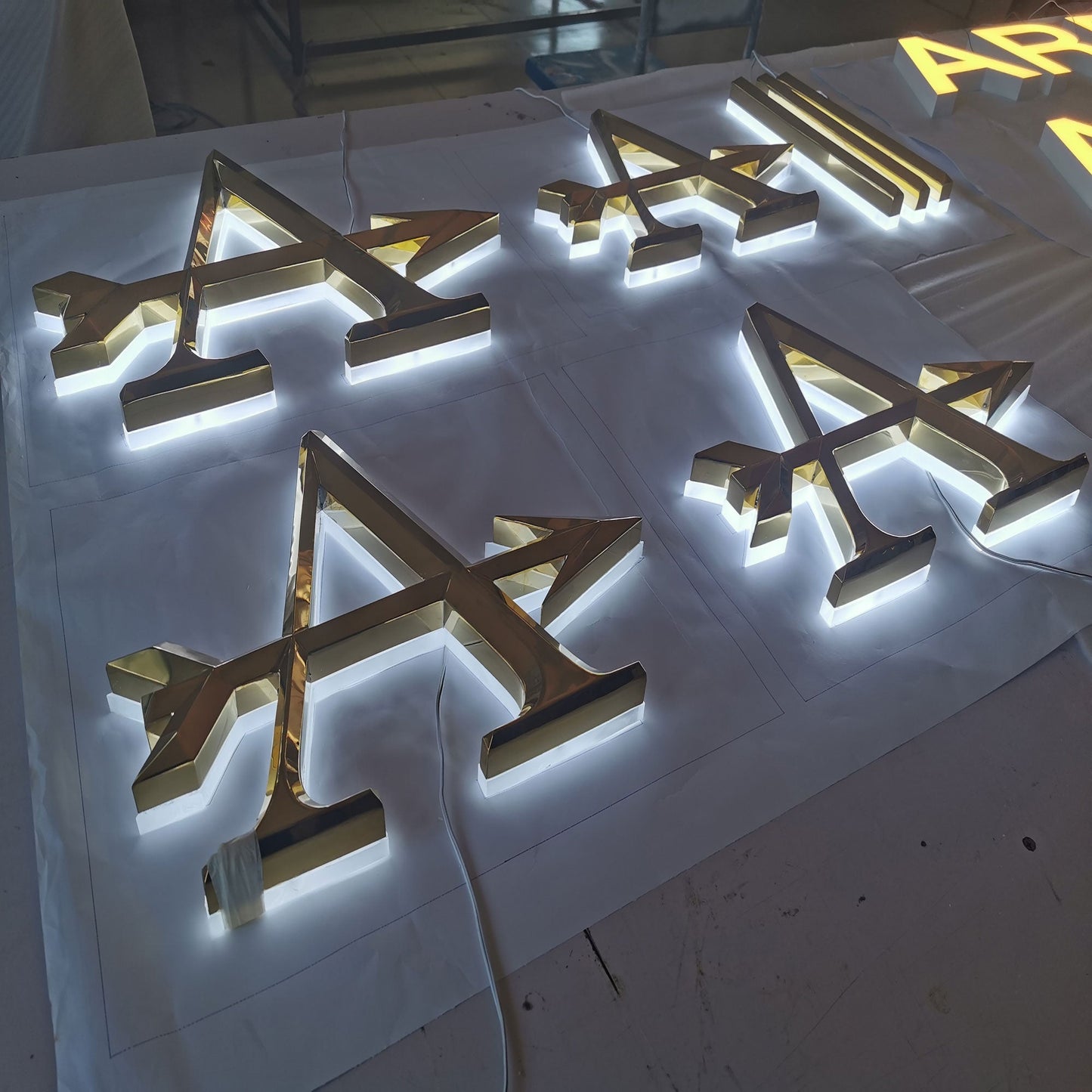Wholesale factory supplies halo lit acrylic LED letters mirror finish golden stainless steel beveled face letter logo