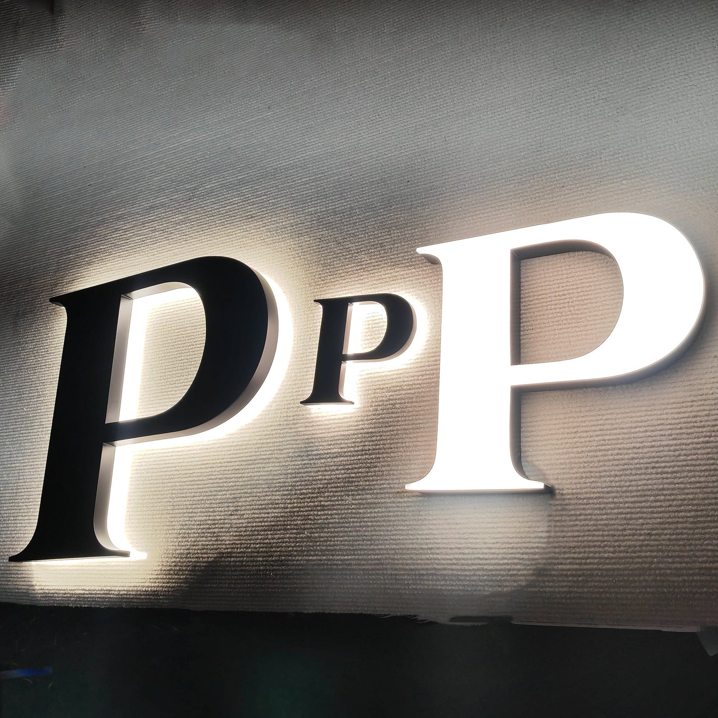 Custom painted stainless steel 3D letters reverse lit channel letters exterior company wall brand signs