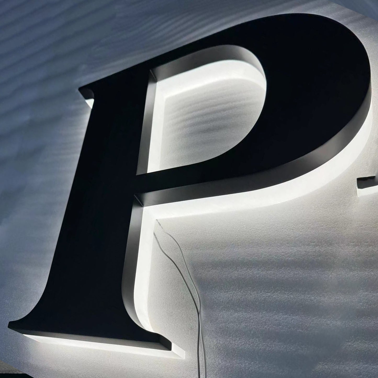Custom painted stainless steel 3D letters reverse lit channel letters exterior company wall brand signs