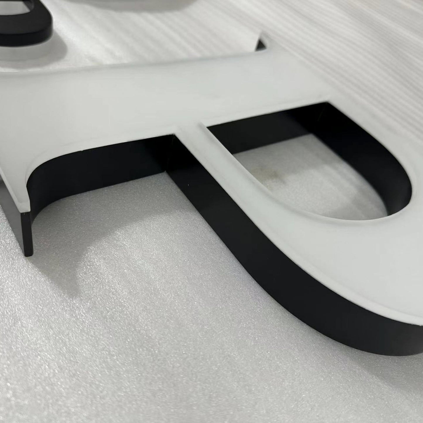 Custom painted stainless steel 3D letters reverse lit channel letters exterior company wall brand signs